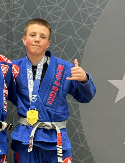 Dylan posing with his gold medal  for Brazilian jiu-jitsu