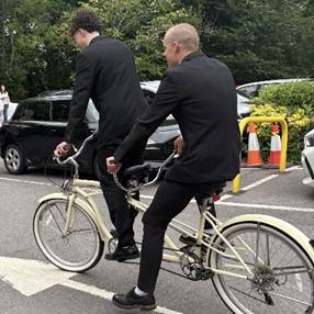 Year 11 students arriving at prom on a tandem bike
