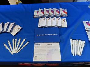 A table of leaflets, notebooks, and pens at HVC careers fair