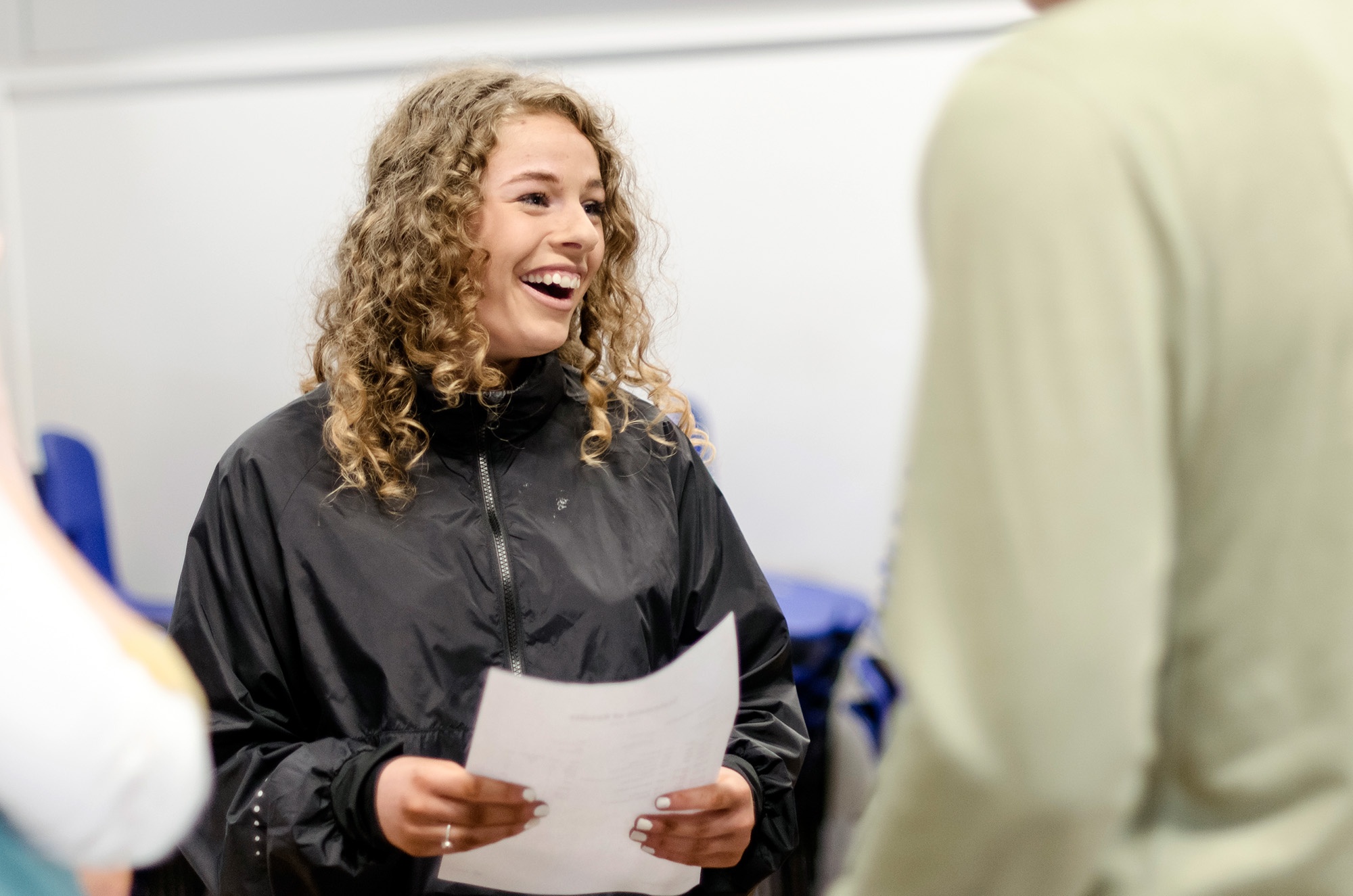 Hope Valley College student opening and celebrating their GCSE results